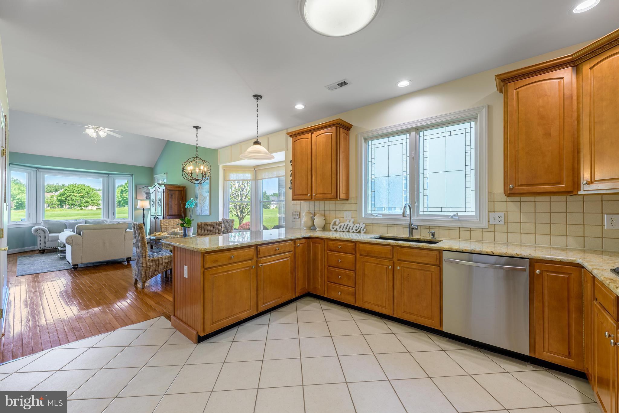 130 Augusta Drive Moorestown, NJ 08057 - Photo 11 of 36 a kitchen with stainless steel appliances granite countertop sink window and cabinets
