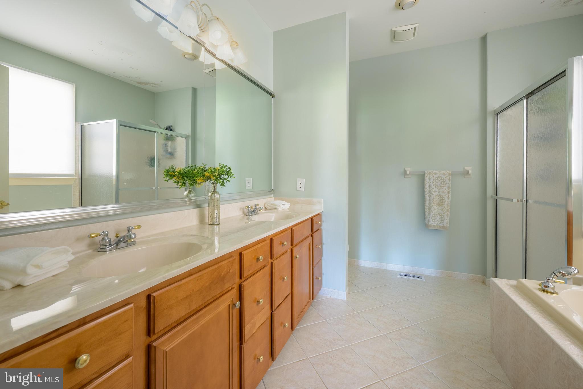 130 Augusta Drive Moorestown, NJ 08057 - Photo 14 of 36 a bathroom with a sink and a mirror