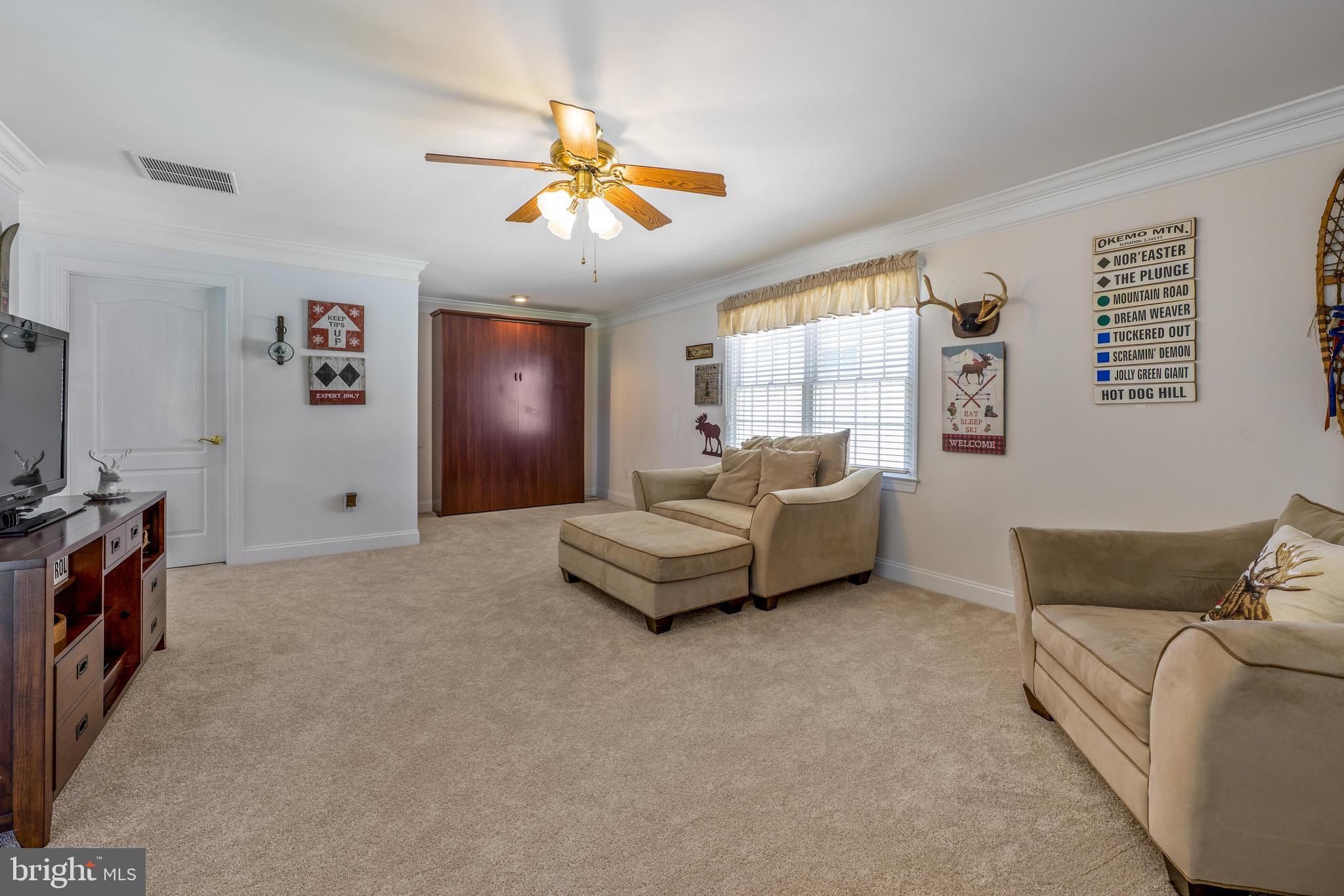 130 Augusta Drive Moorestown, NJ 08057 - Photo 18 of 36 a living room with furniture and a flat screen tv