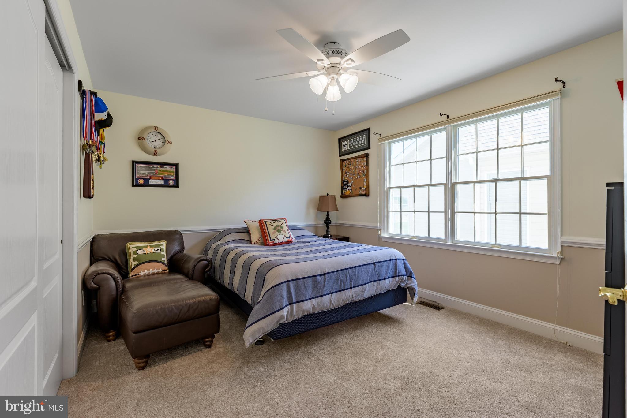 130 Augusta Drive Moorestown, NJ 08057 - Photo 19 of 36 a bedroom with a bed couch and a window