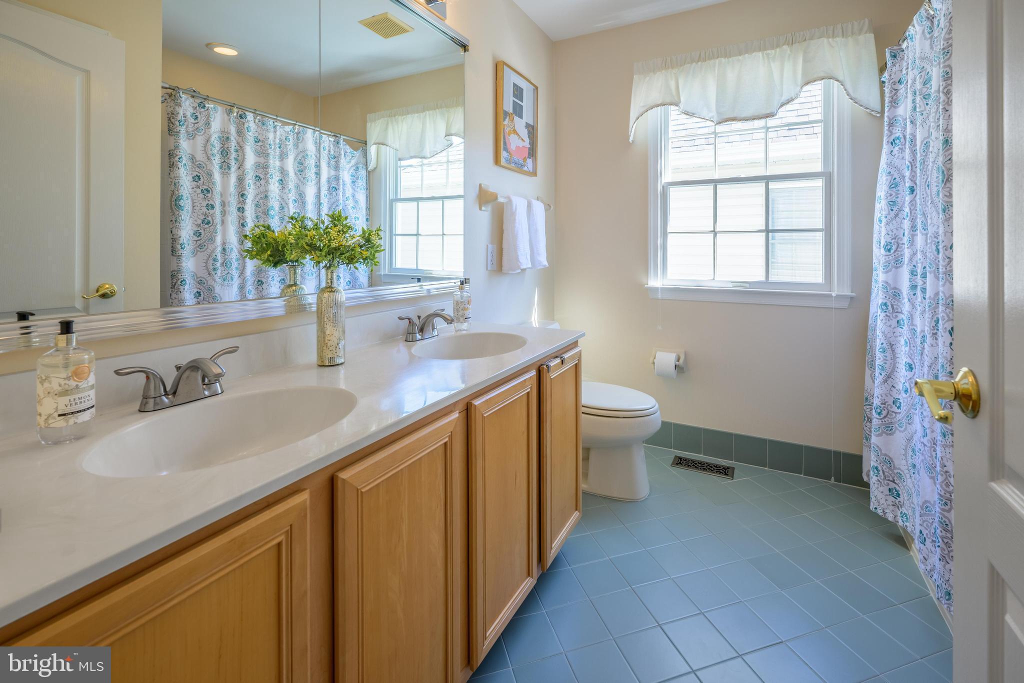 130 Augusta Drive Moorestown, NJ 08057 - Photo 21 of 36 a bathroom with a double vanity sink toilet and a mirror