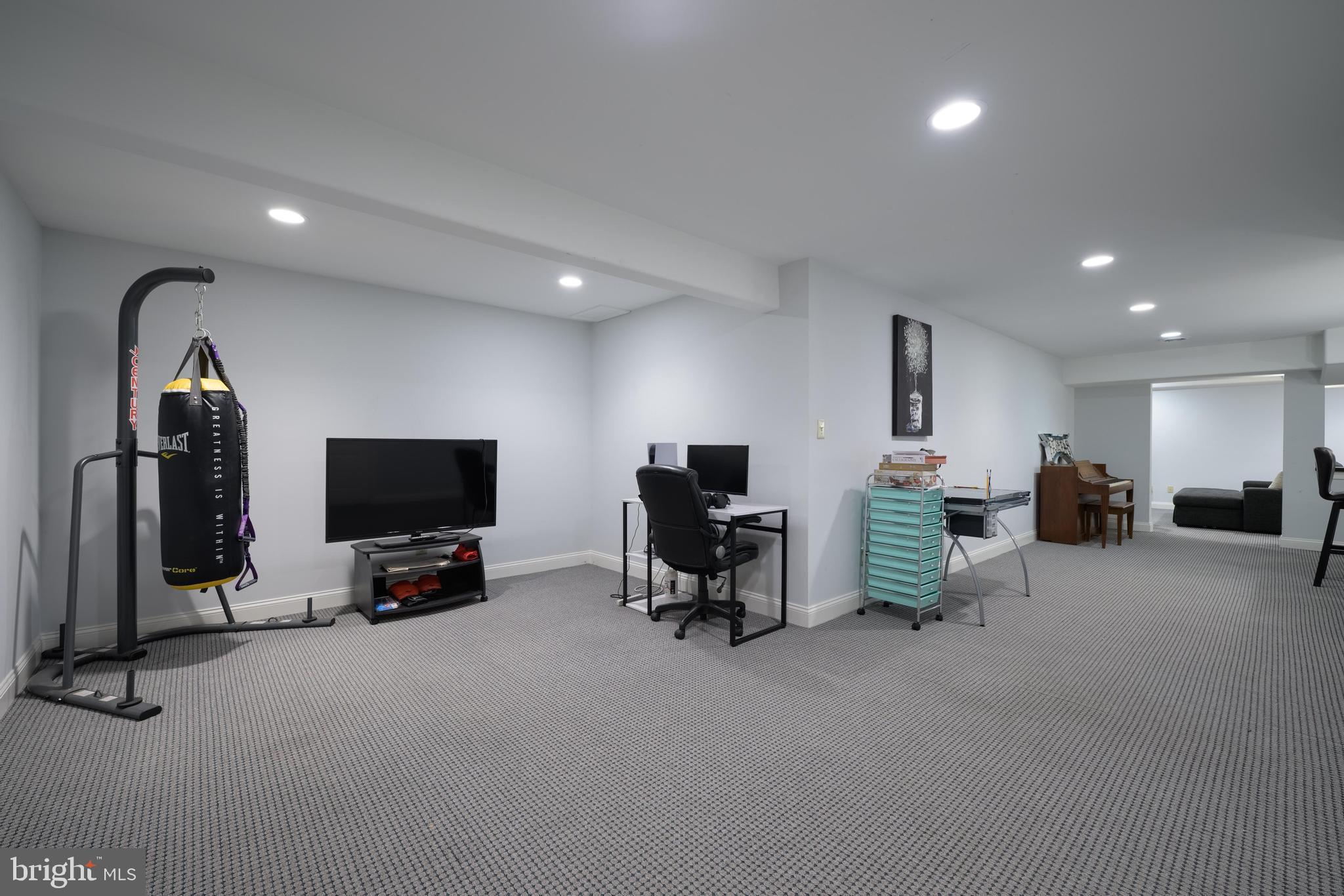 130 Augusta Drive Moorestown, NJ 08057 - Photo 24 of 36 a living room with furniture and a flat screen tv