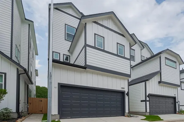 a front view of a house with garage