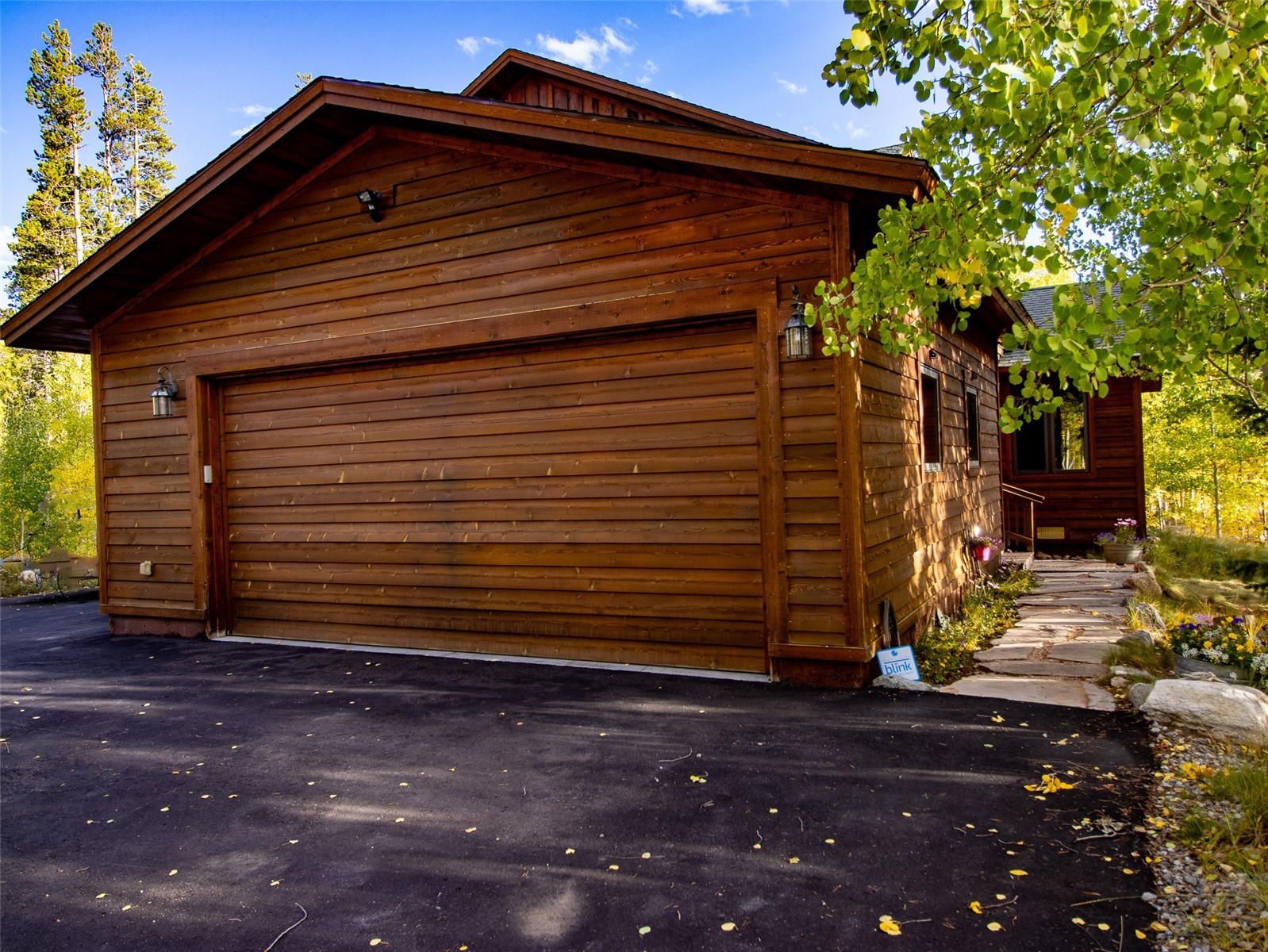 228 Glacier Ridge Road Alma, CO 80420 - Photo 43 of 50 a front view of a house with a garden