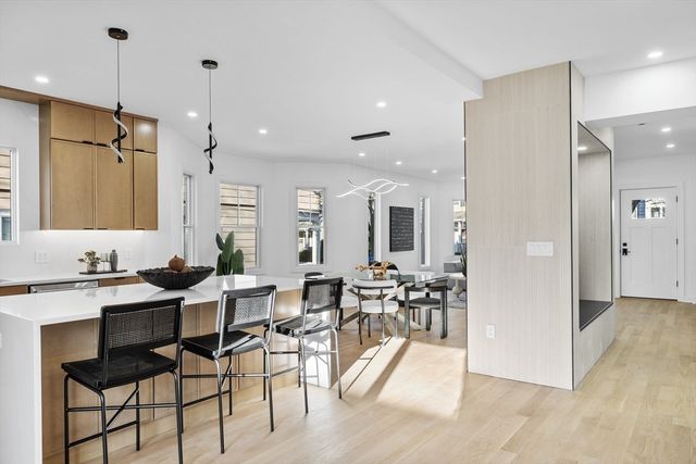 a bedroom with a bed and a large mirror