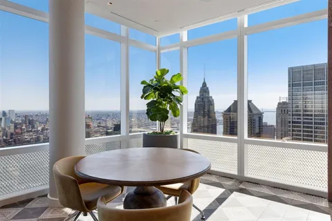 a view of roof deck with seating space and appliances