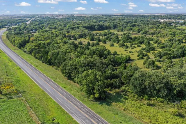 a view of a green field with a yard