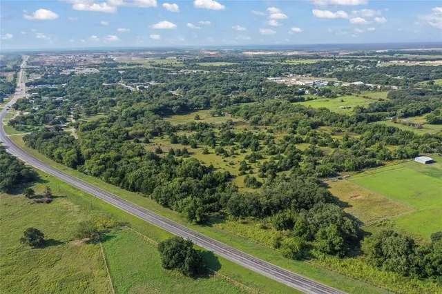a view of a yard with an outdoor seating