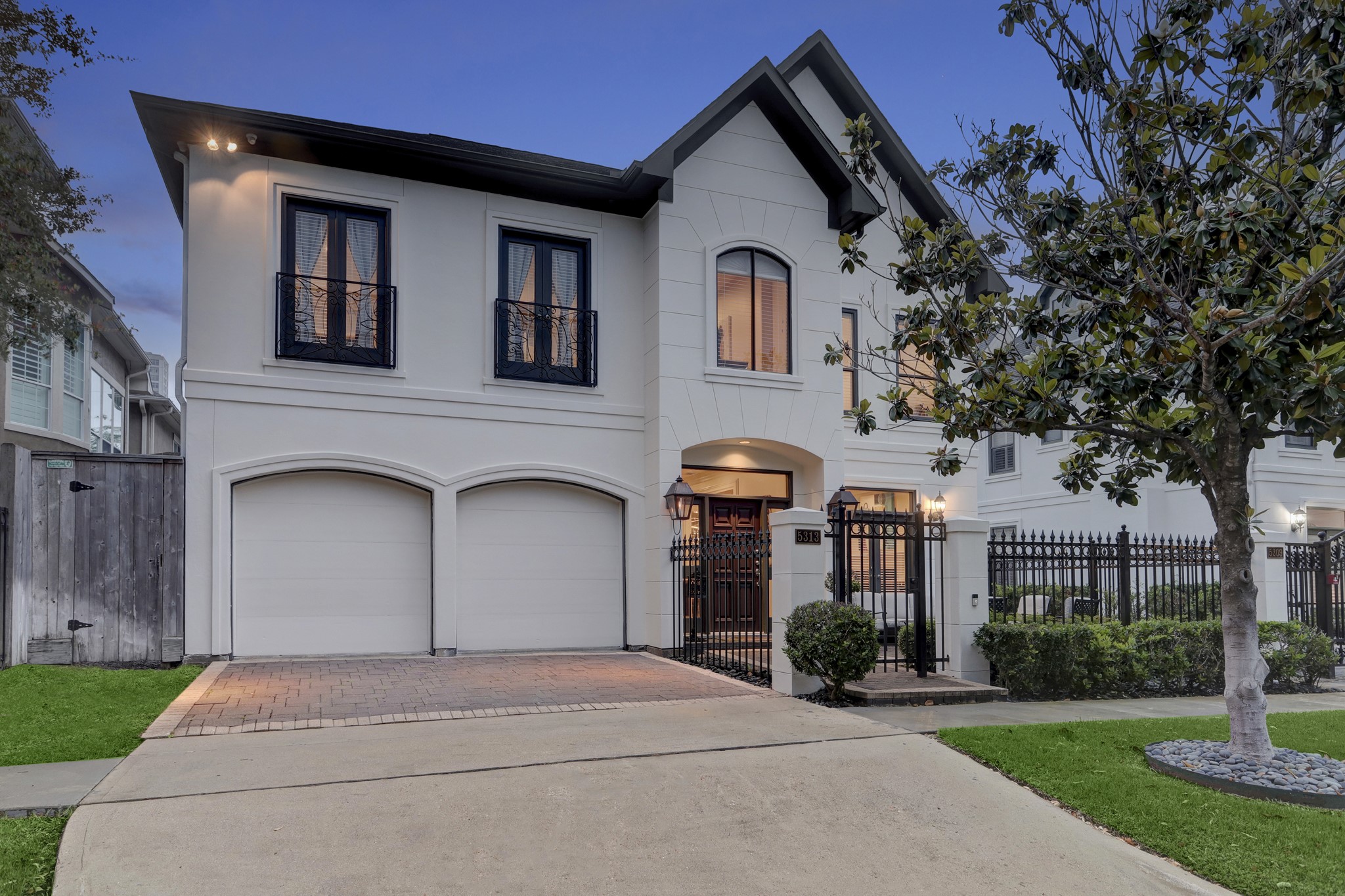 a front view of a house with garden