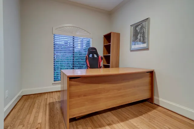 a view of wooden floor and windows in a room