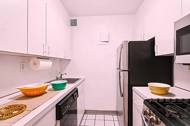 a kitchen with stainless steel appliances granite countertop a sink and a stove