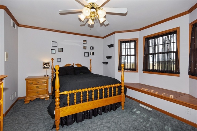 4965 South Old Mazon Road Mazon, IL 60444 - Photo 22 of 40 a bed sitting in a room next to a window