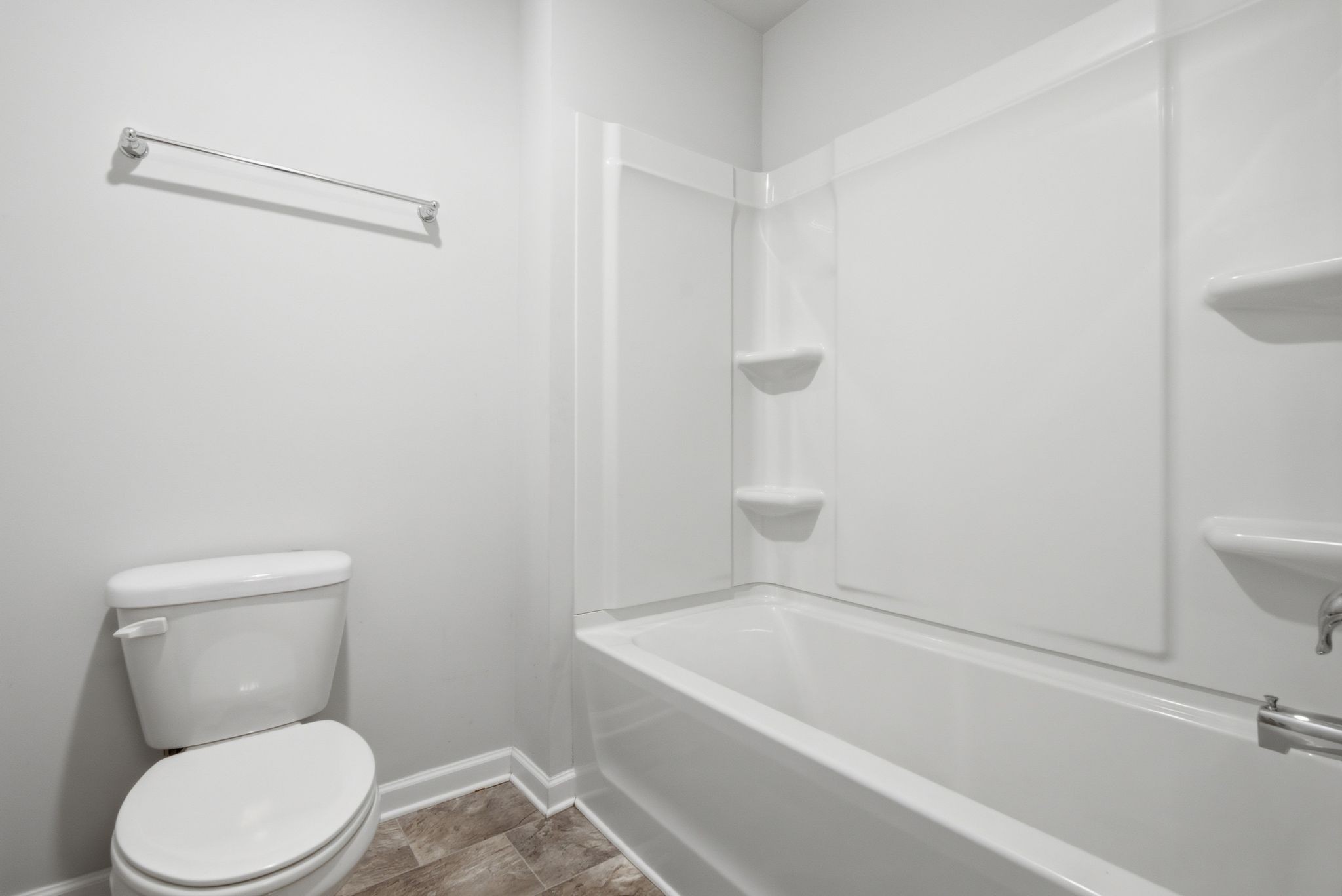 514 Ash Street Lebanon, TN 37087 - Photo 35 of 37 a white toilet sitting next to a bath tub