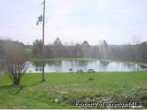 0 Gage Road Lawton, PA 18828 - Photo 2 of 2 a view of a garden from a lake