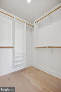 a view of an empty walk in closet