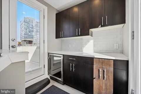 a kitchen with a sink and a refrigerator
