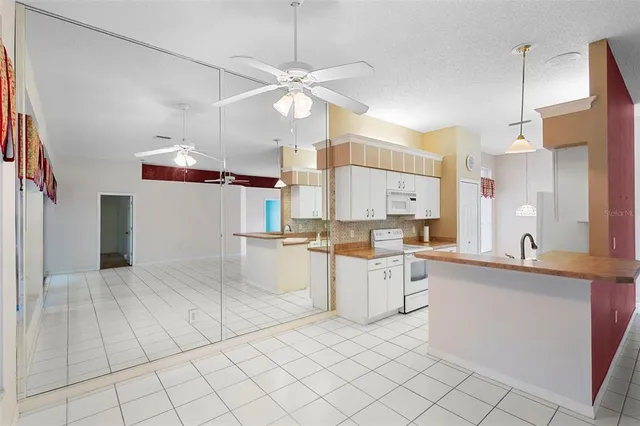 a kitchen with a sink cabinets and window