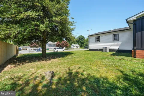 a view of a backyard with a house