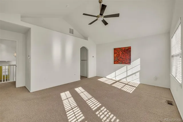 a spacious bathroom with a double vanity sink a large mirror and shower