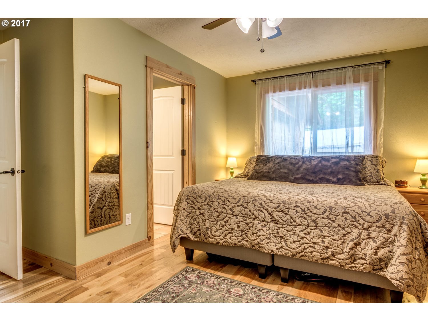 64877 East Pine Tree Way Rhododendron, OR 97049 - Photo 14 of 29 a bedroom with a bed and a window