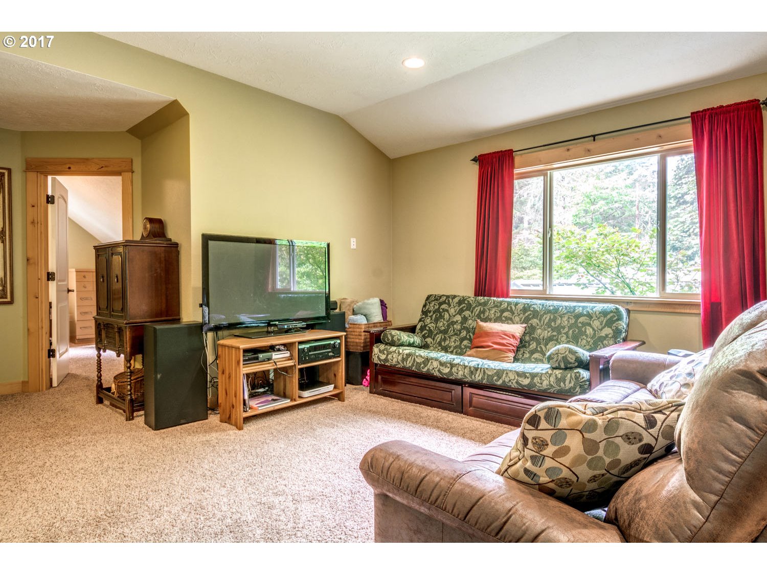 64877 East Pine Tree Way Rhododendron, OR 97049 - Photo 17 of 29 a living room with furniture and a flat screen tv