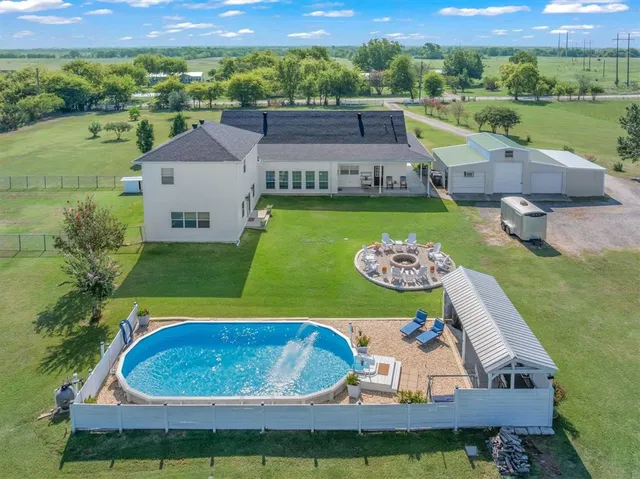a view of a balcony with a garden and deck