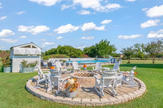 a view of a swimming pool with a patio