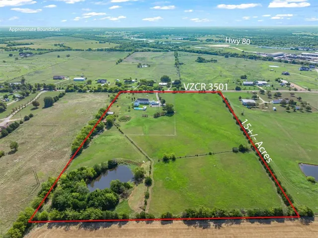 a view of a lake in middle of the forest