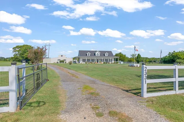 a sitting area with furniture in front of house