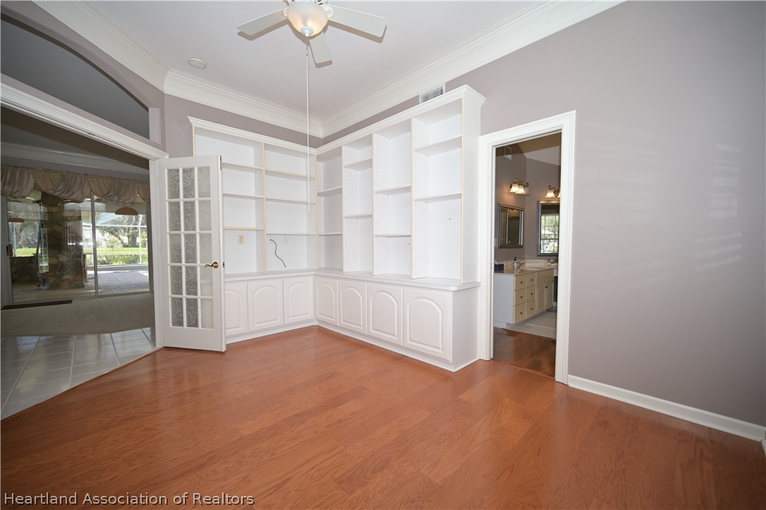 2737 Cheyenne Road Sebring, FL 33875 - Photo 15 of 50 an empty room with cabinet and mirrors