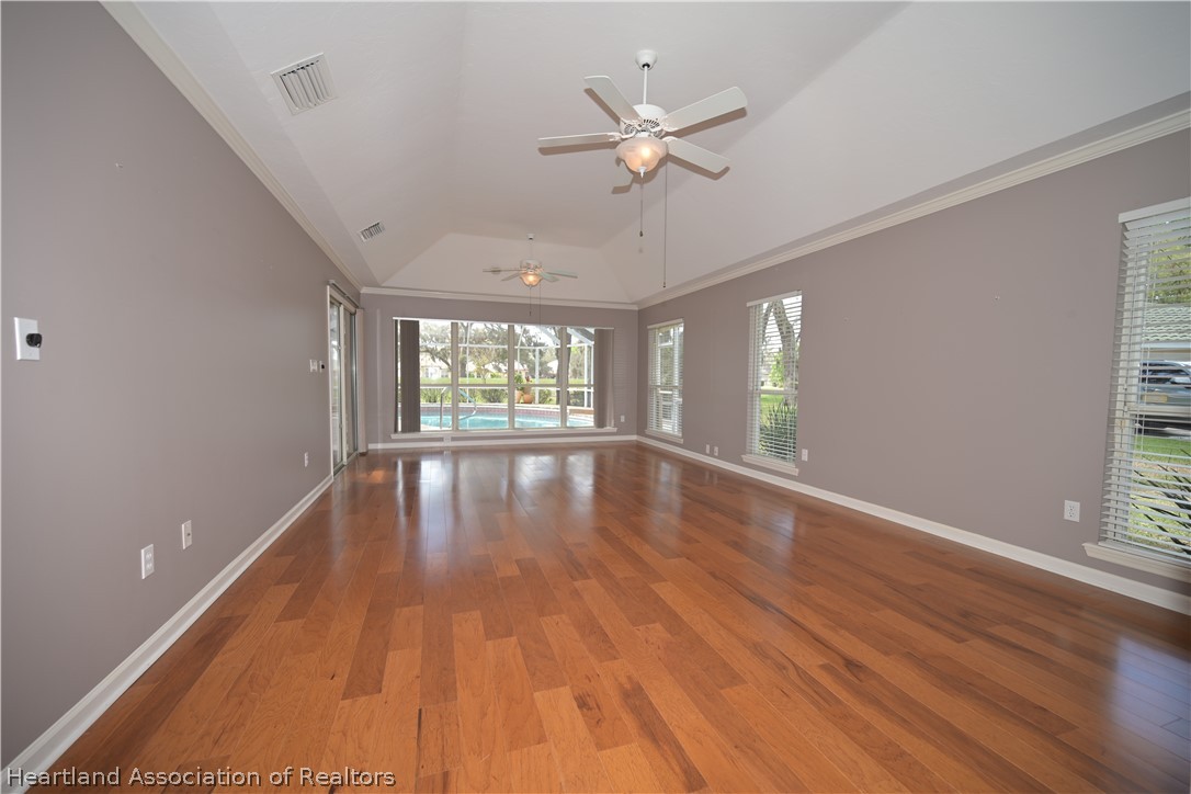 2737 Cheyenne Road Sebring, FL 33875 - Photo 17 of 50 wooden floor in an empty room with a window