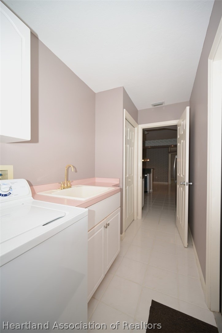 2737 Cheyenne Road Sebring, FL 33875 - Photo 36 of 50 a view of hallway with washer and dryer