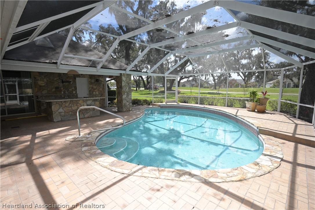 2737 Cheyenne Road Sebring, FL 33875 - Photo 38 of 50 a view of a swimming pool with a patio