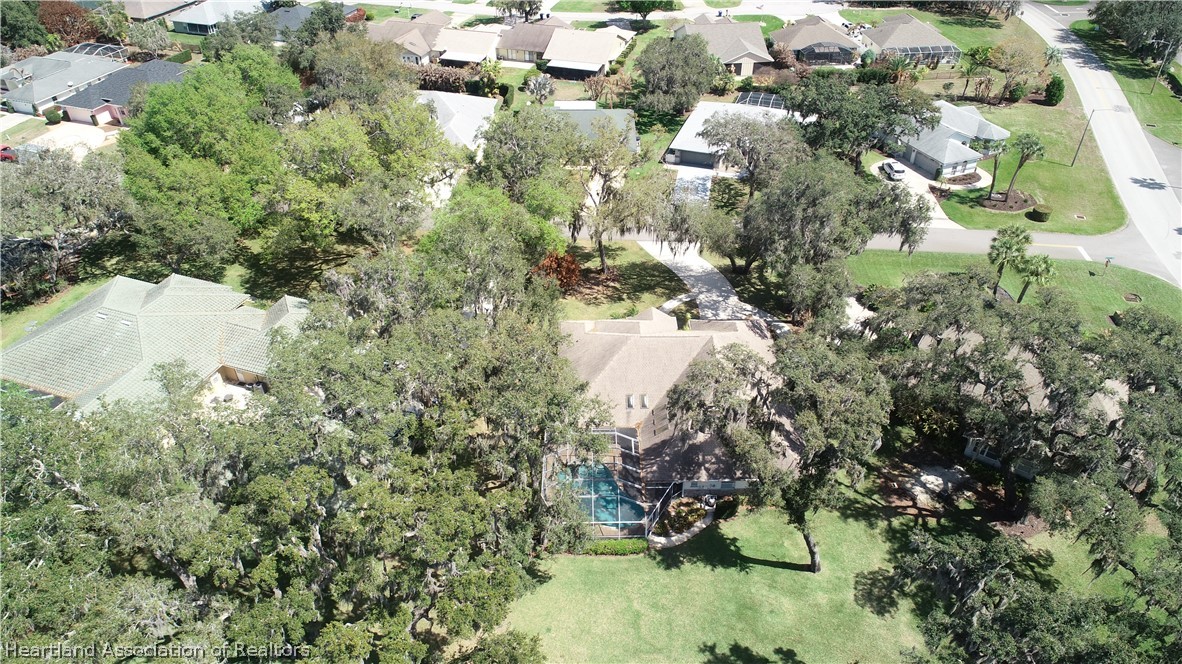 2737 Cheyenne Road Sebring, FL 33875 - Photo 46 of 50 an aerial view of residential houses with outdoor space and trees