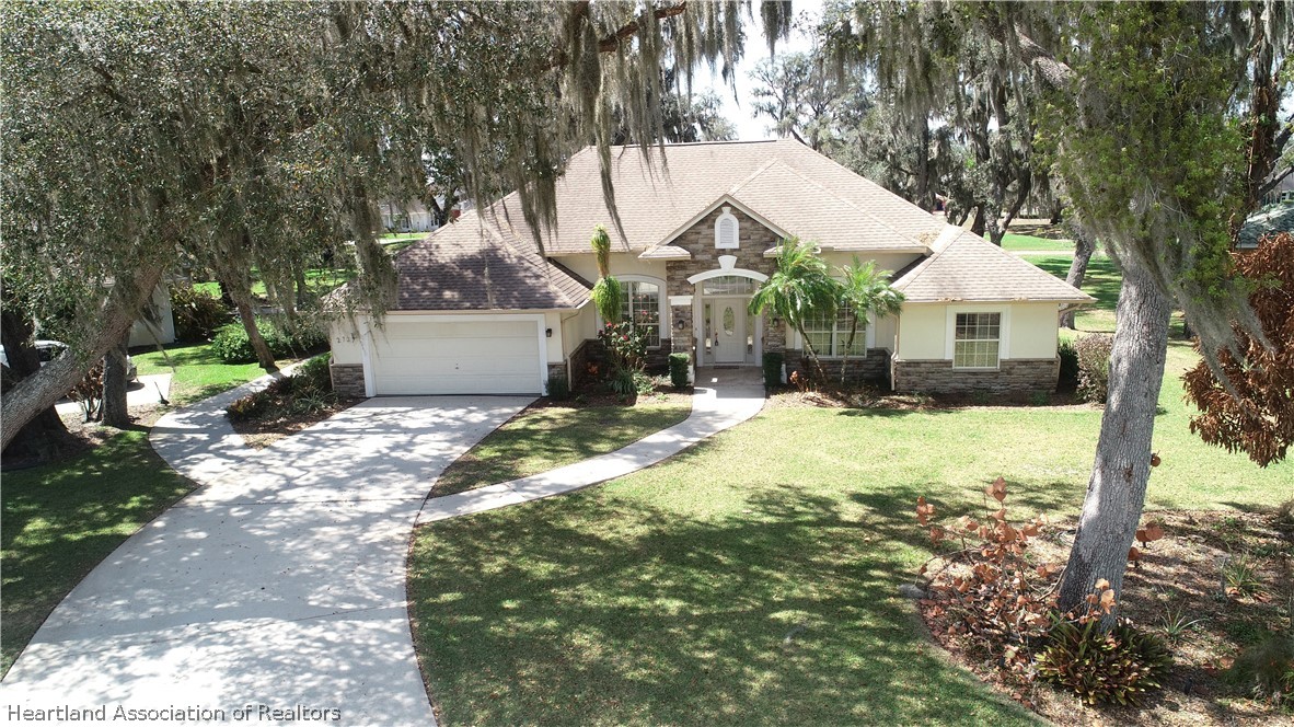 2737 Cheyenne Road Sebring, FL 33875 - Photo 50 of 50 a view of a house with a yard