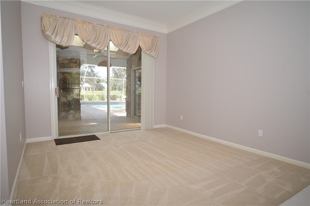 2737 Cheyenne Road Sebring, FL 33875 - Photo 6 of 50 a view of an empty room with a sliding door