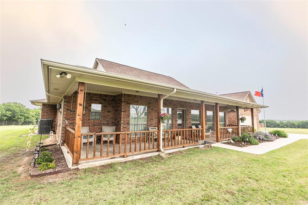 2168 Fruitland Road Sunset, TX 76270 - Photo 2 of 40 front view of house with a yard