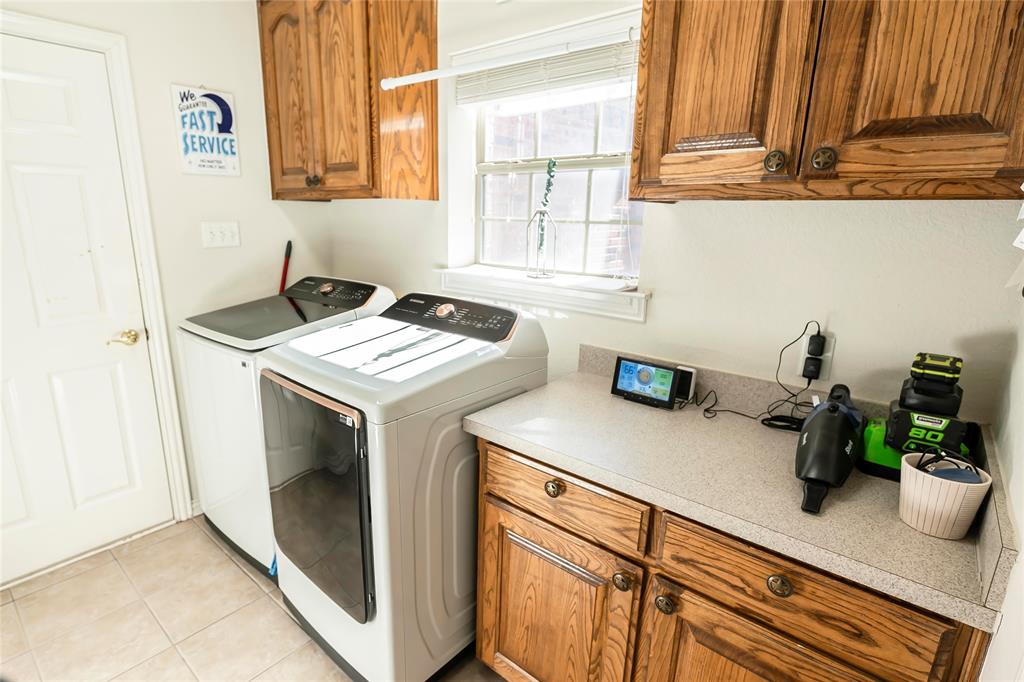 2168 Fruitland Road Sunset, TX 76270 - Photo 30 of 40 a view of a kitchen with sink and washing machine