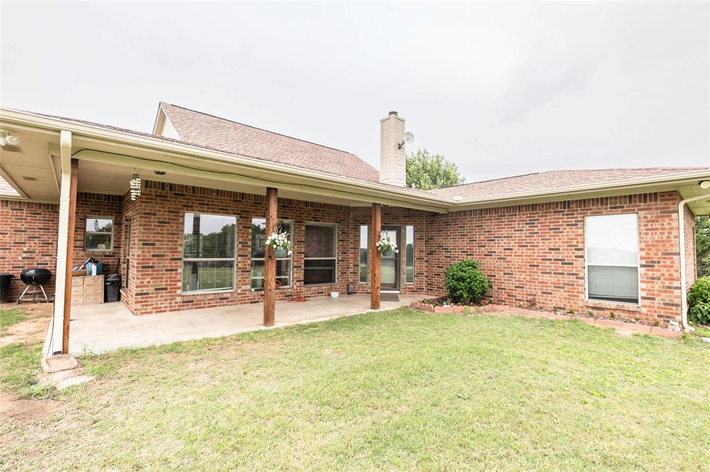 2168 Fruitland Road Sunset, TX 76270 - Photo 10 of 40 front view of a building with garden