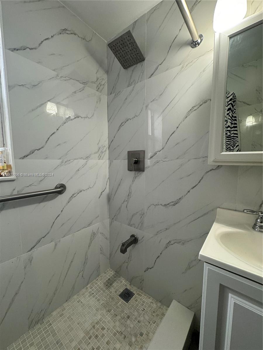 3551 Southwest 10th Street, Unit 8A Miami, FL 33135 - Photo 9 of 10 a bathroom with a sink and a shower