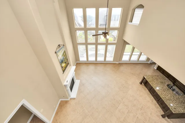 a spacious bathroom with a tub a double vanity sink and a window