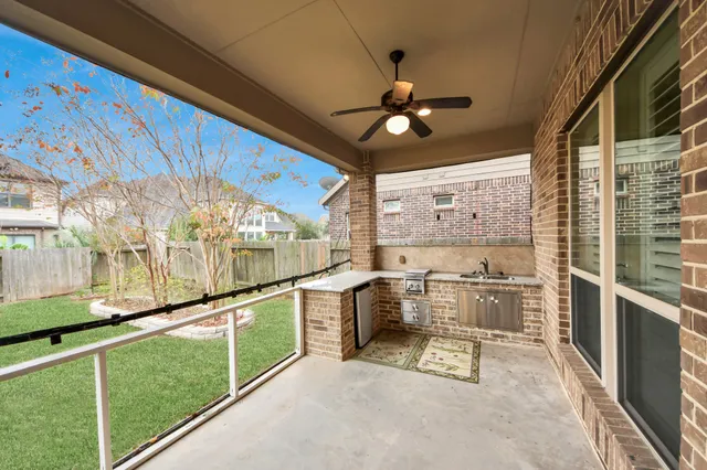 a view of a house with backyard porch and sitting area