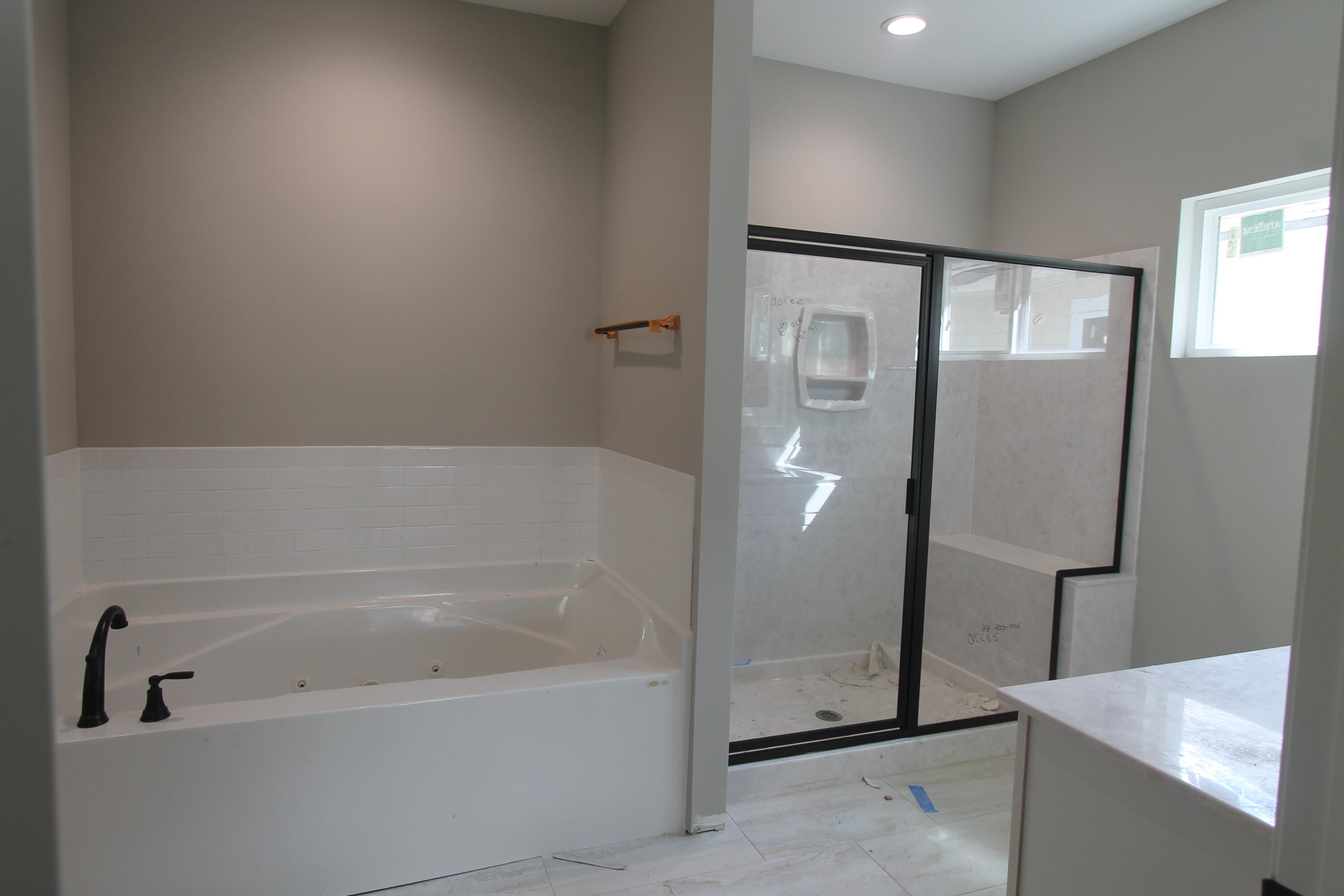 33 8th Avenue Shalimar, FL 32579 - Photo 5 of 13 a bathroom with a bathtub and a shower