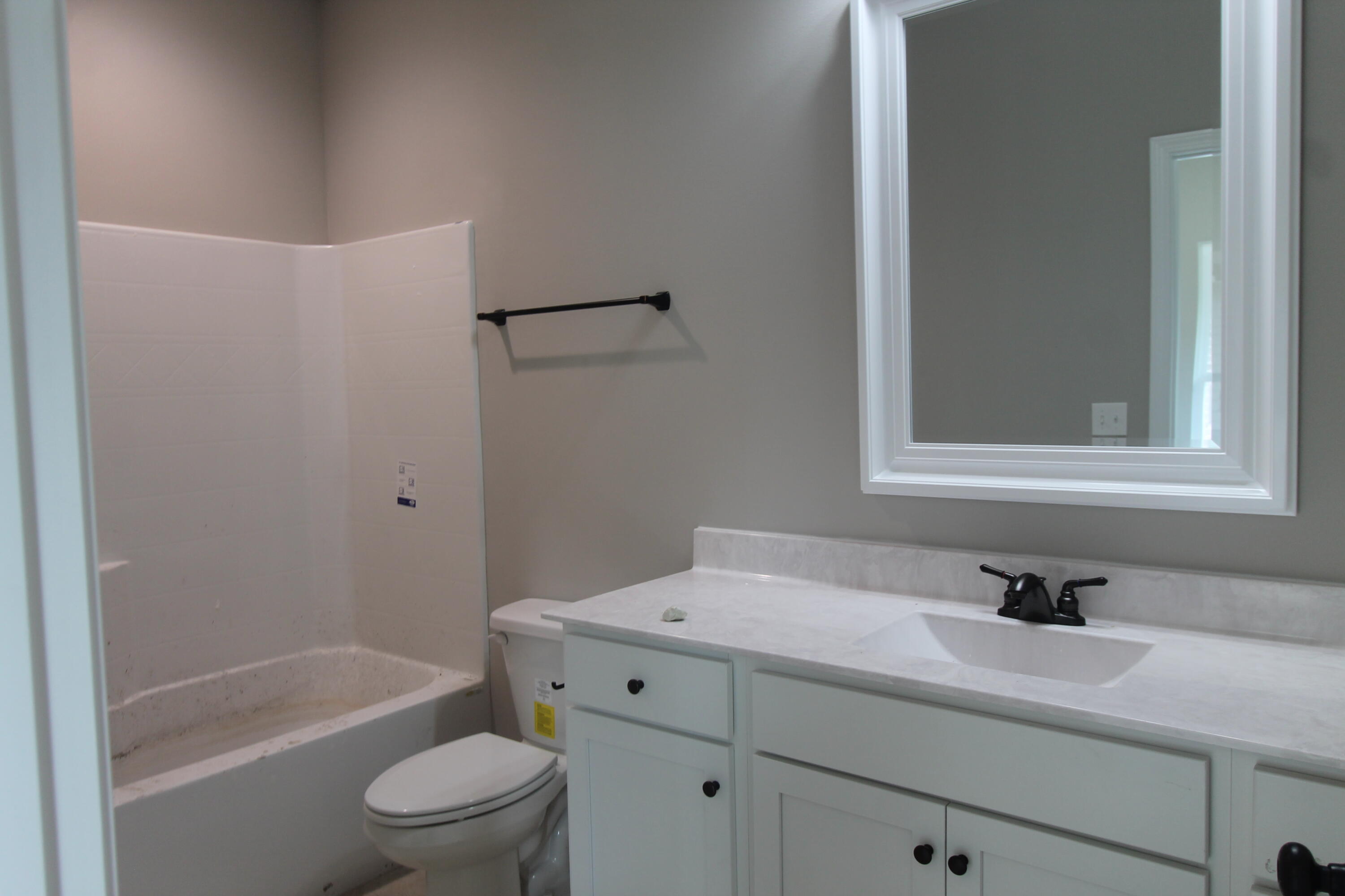 33 8th Avenue Shalimar, FL 32579 - Photo 8 of 13 a bathroom with a sink a toilet and shower