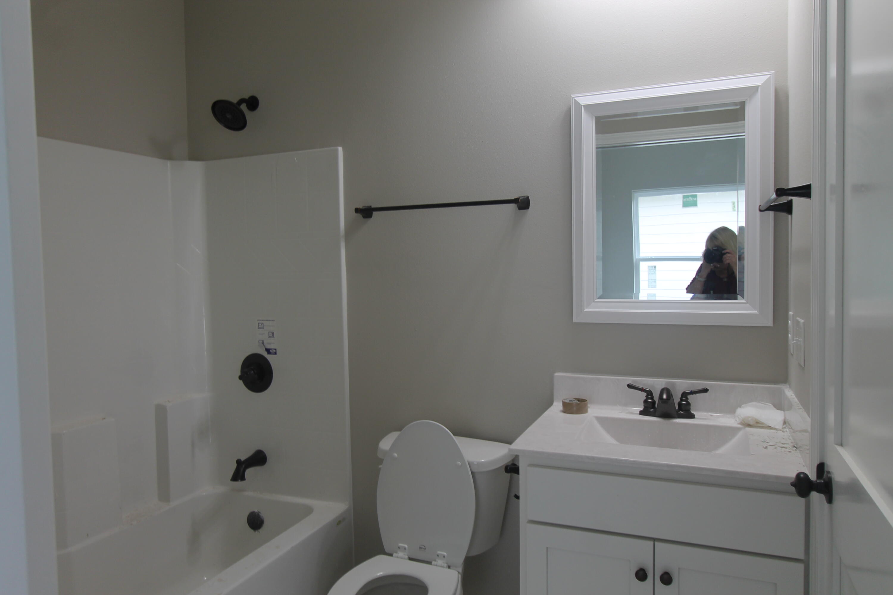 33 8th Avenue Shalimar, FL 32579 - Photo 9 of 13 a bathroom with a sink toilet and shower