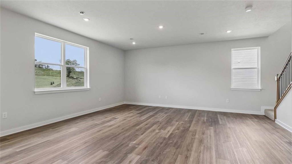 1099 Peachtree Road Carnegie, PA 15106 - Photo 20 of 25 an empty room with wooden floor and windows
