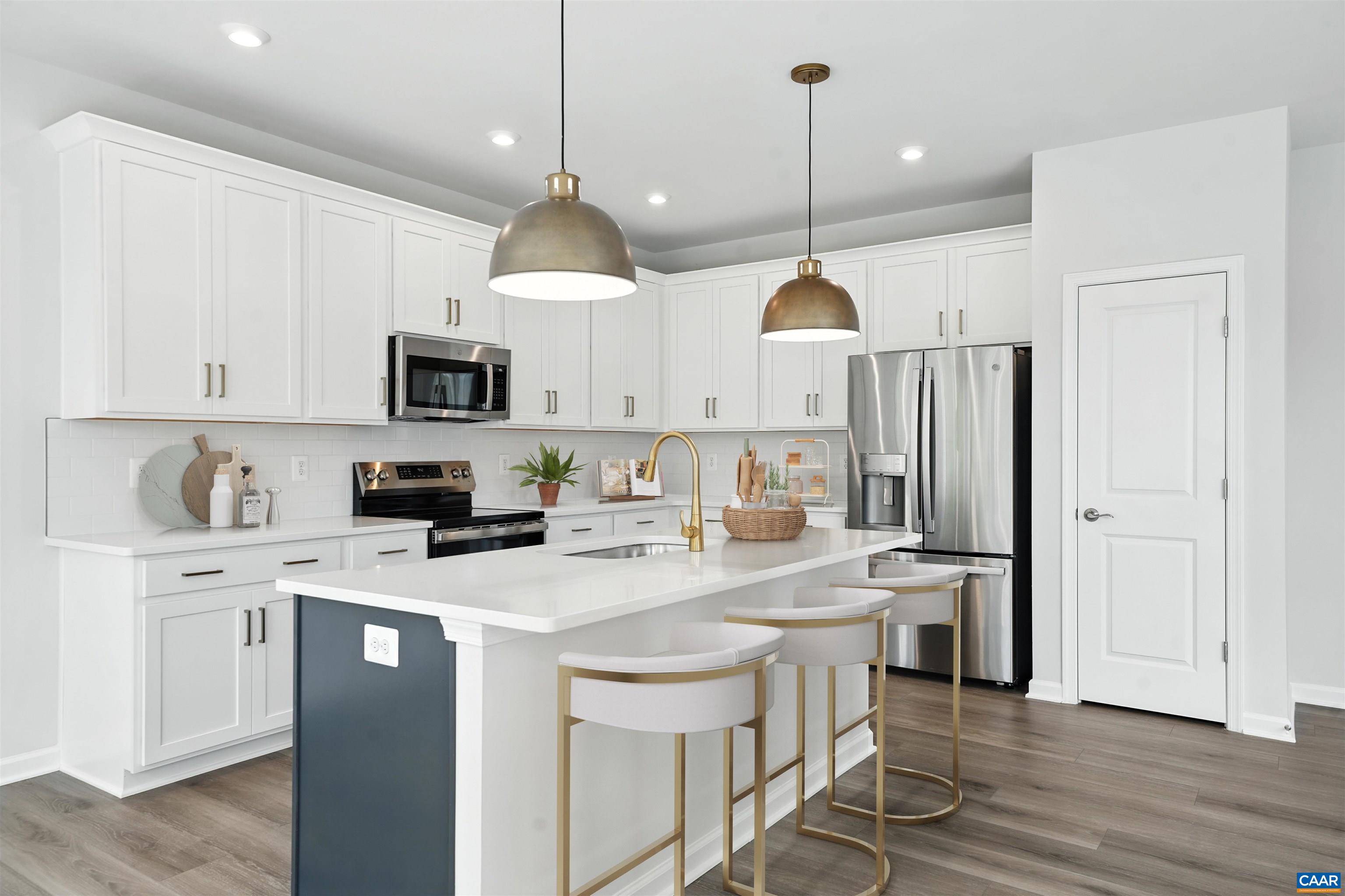 3071 Rambling Brk Lane Crozet, VA 22932 - Photo 7 of 38 a kitchen with a sink a microwave and wooden floor