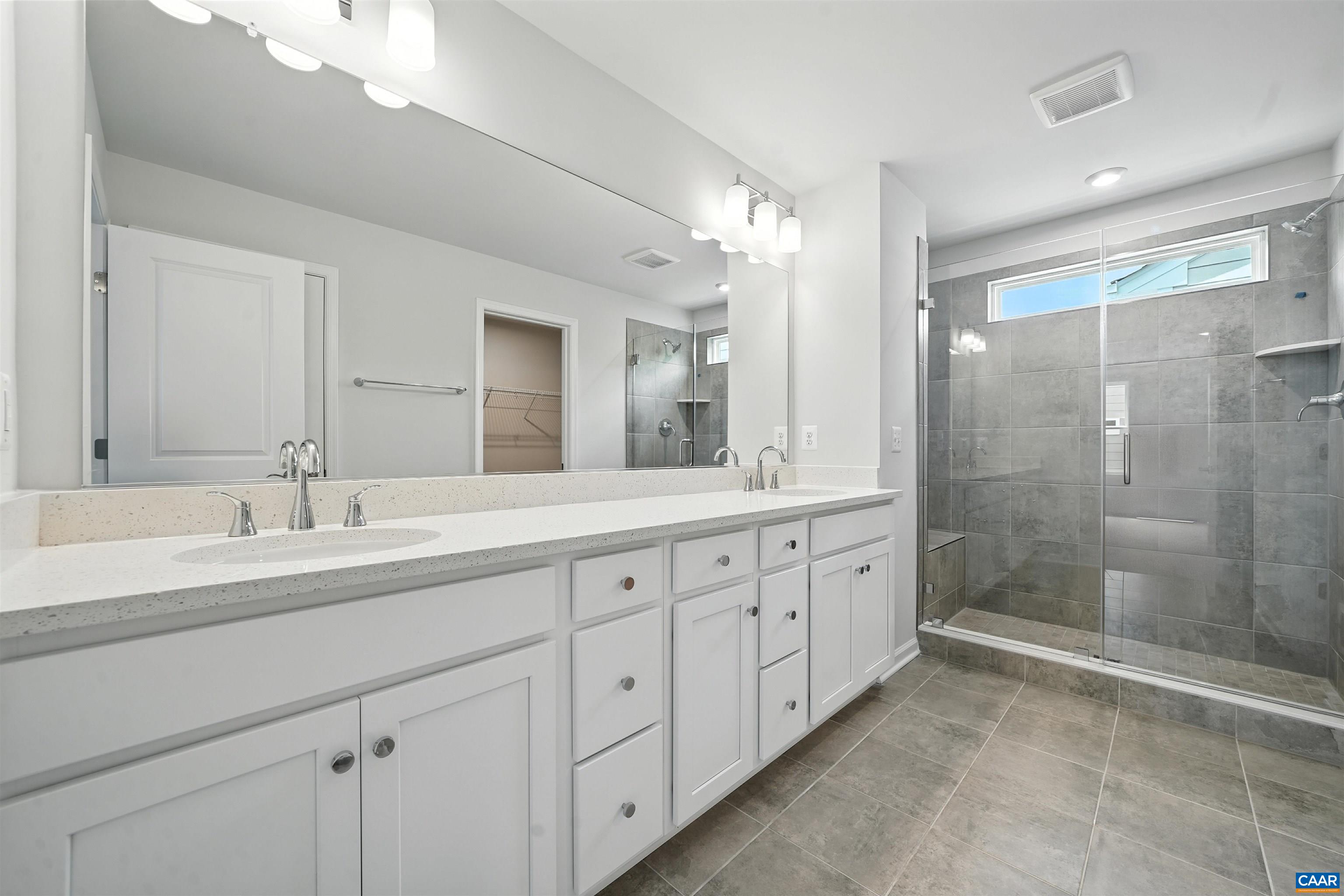 3071 Rambling Brk Lane Crozet, VA 22932 - Photo 9 of 38 a spacious bathroom with double sink and a mirror