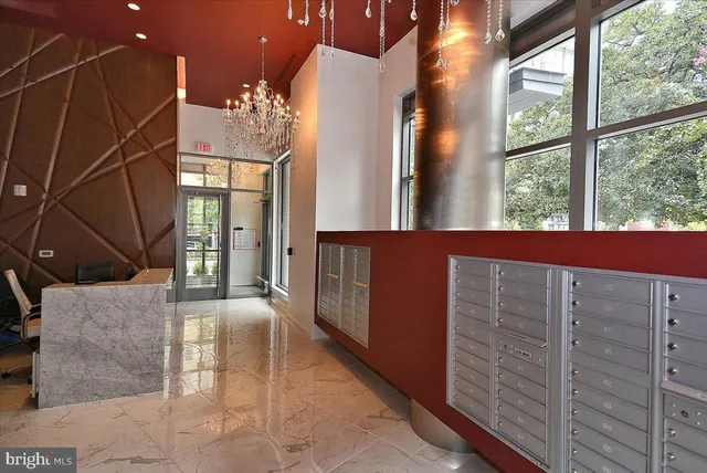 a living room with furniture and flowers