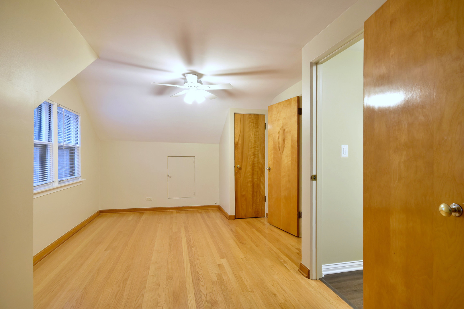 632 Bryan Street Elmhurst, IL 60126 - Photo 19 of 33 a view of empty room with wooden floor and fan